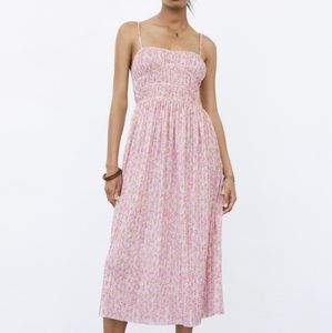 Printed pleated midi dress.